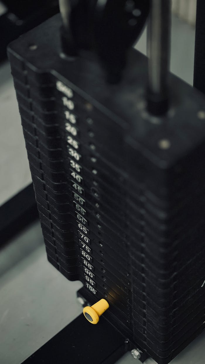 Detailed view of a weight stack on gym equipment for strength training workouts.